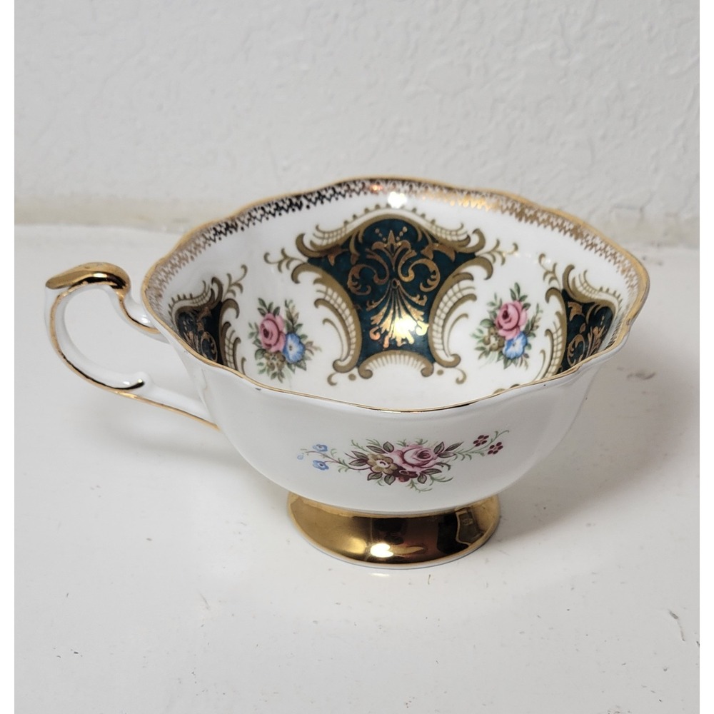 Paragon teacup - dark green panels on white background with‎ floral decor...Read